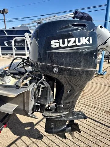 Slide: The Image of Suzuki outboard motor on Avalon VTX1880QF, 2022 model, displayed outdoors. - 8