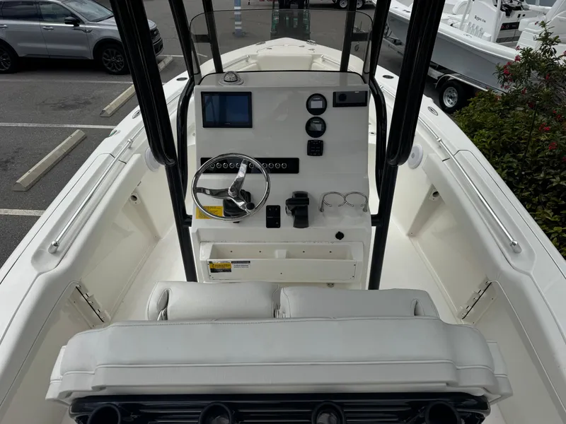 Slide: The Image of 2025 Key West 219 FS boat interior with steering console and seating. - 13