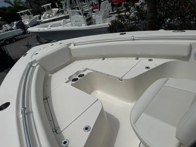 Slide: The Image of 2025 Key West 219 FS boat interior with seating and storage compartments. - 19