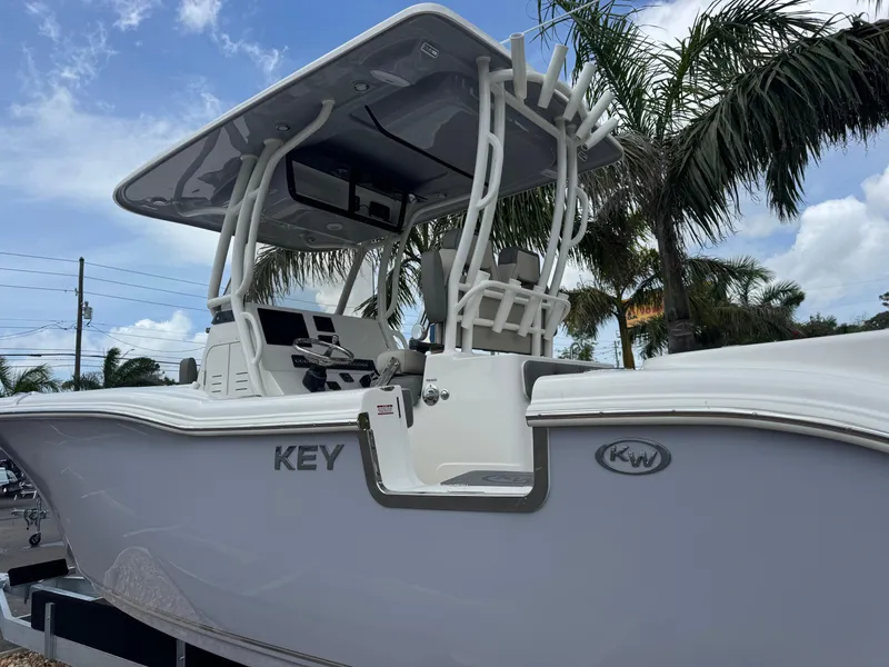 Slide: The Image of 2025 Key West 260 boat with T-top, palm trees in background. - 10