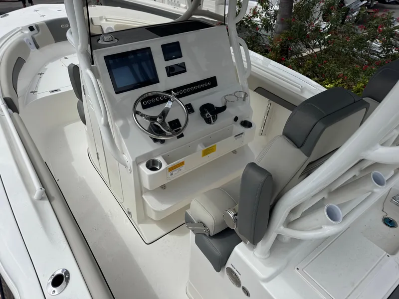 Slide: The Image of 2025 Key West 260 boat interior with modern helm and seating. - 13