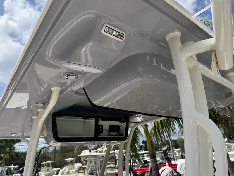 Slide: The Image of 2025 Key West 260 boat T-top with integrated electronics and sleek design. - 16