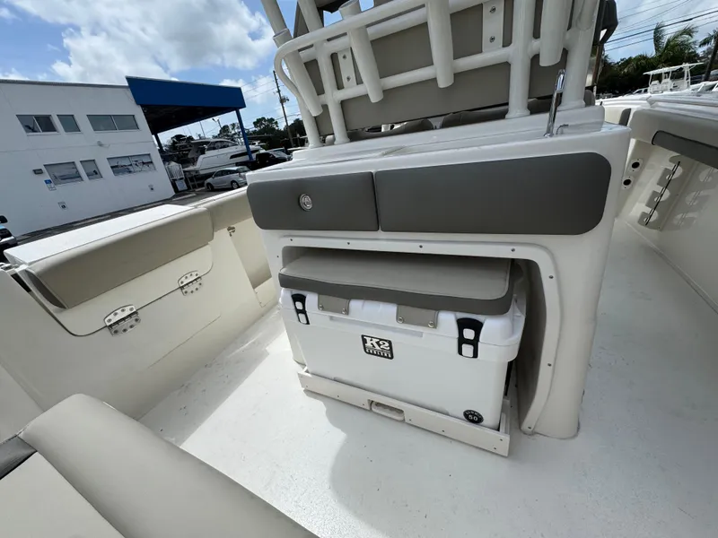 Slide: The Image of 2025 Key West 260 boat interior with seating and cooler storage. - 35