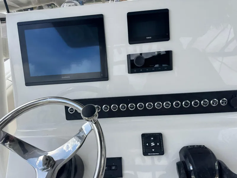 Slide: The Image of Steering console of 2025 Key West 260 boat with modern navigation equipment. - 38