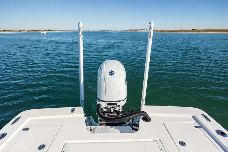 Slide: The Image of 2024 Sea Born FX22 Bay boat with Suzuki outboard motor on calm water. - 29
