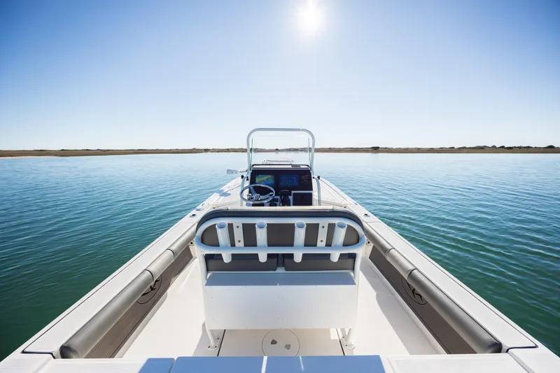 Slide: The Image of 2024 Sea Born FX22 Bay boat on calm water under clear sky. - 31