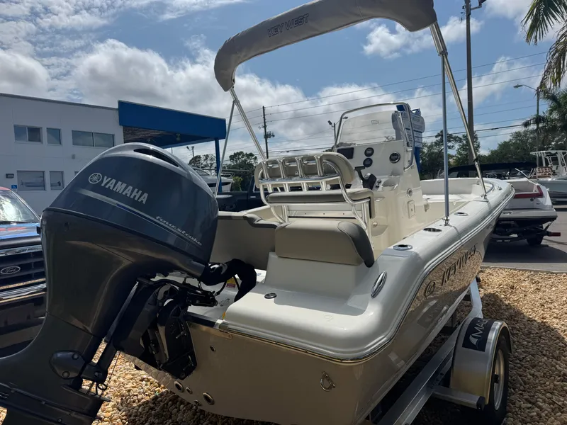 Slide: The Image of 2025 Key West 189 FS boat with Yamaha outboard motor, parked on a trailer. - 10