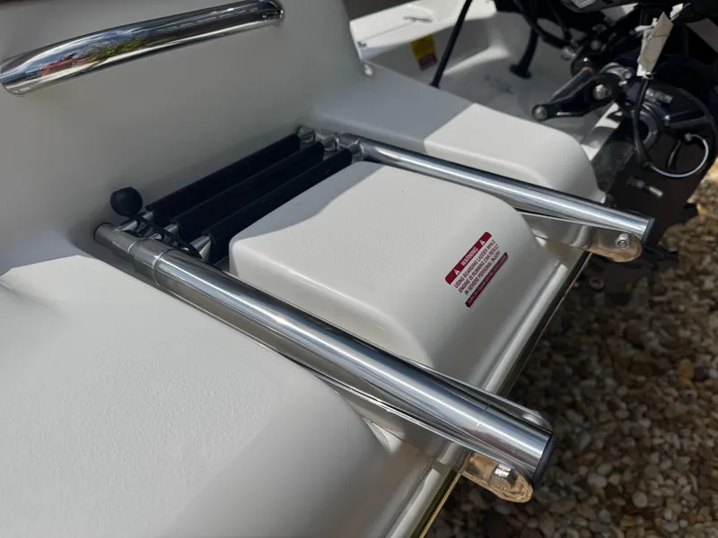 Slide: The Image of 2025 Key West 189 FS boat ladder and platform detail, featuring stainless steel components. - 13