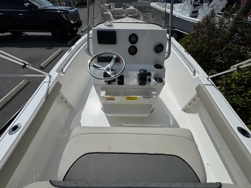 Slide: The Image of 2025 Key West 189 FS boat interior with steering console and seating. - 17