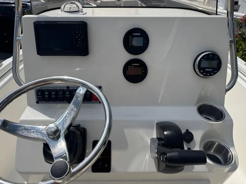 Slide: The Image of Steering console of 2025 Key West 189 FS boat with gauges and controls. - 20