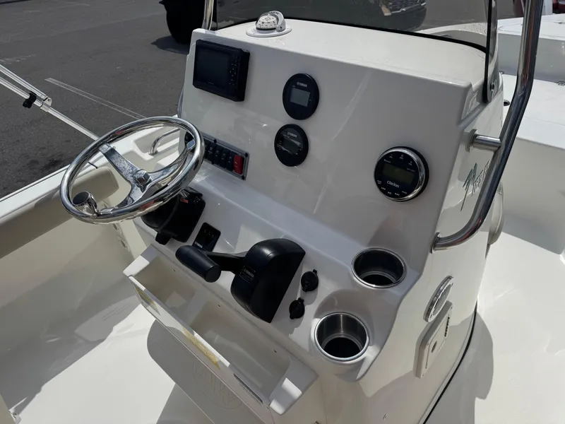 Slide: The Image of Center console of 2025 Key West 189 FS boat with steering wheel and controls. - 21