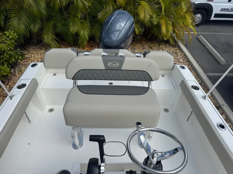 Slide: The Image of 2025 Key West 189 FS boat interior with steering wheel and seating. - 32