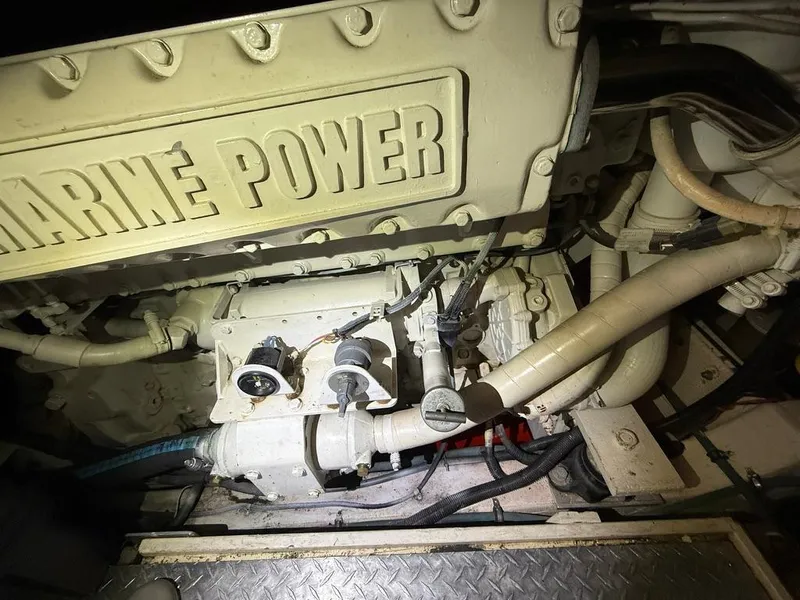Slide: The Image of Engine compartment of 1989 Post 43 Sport Fisherman with Marine Power branding. - 23