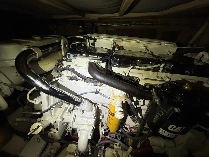 Slide: The Image of Engine of a 1989 Post 43 Sport Fisherman boat, featuring CAT components. - 24