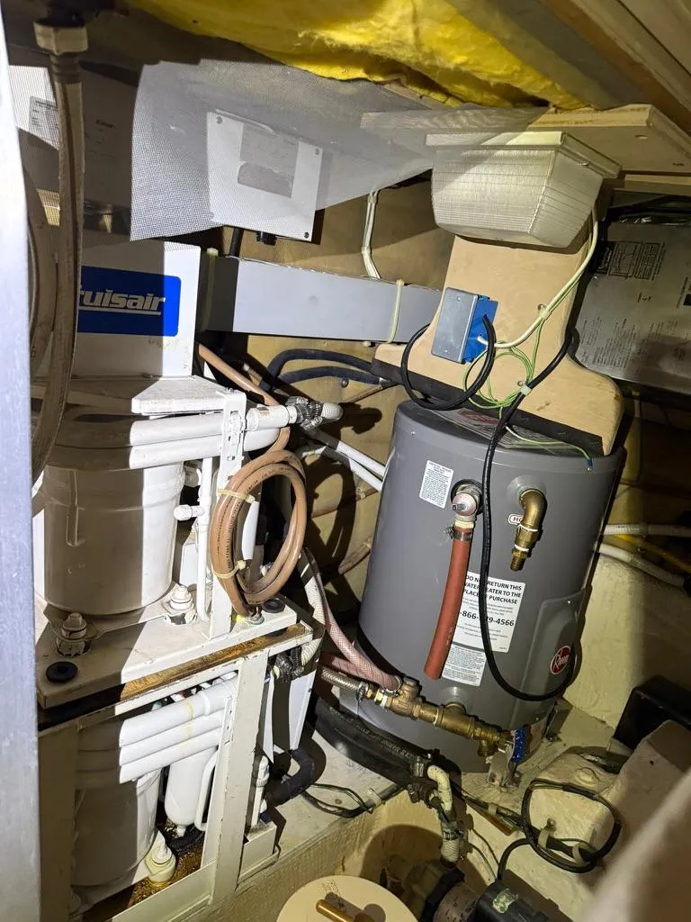 Slide: The Image of Engine room of 1989 Post 43 Sport Fisherman with mechanical equipment and wiring. - 27