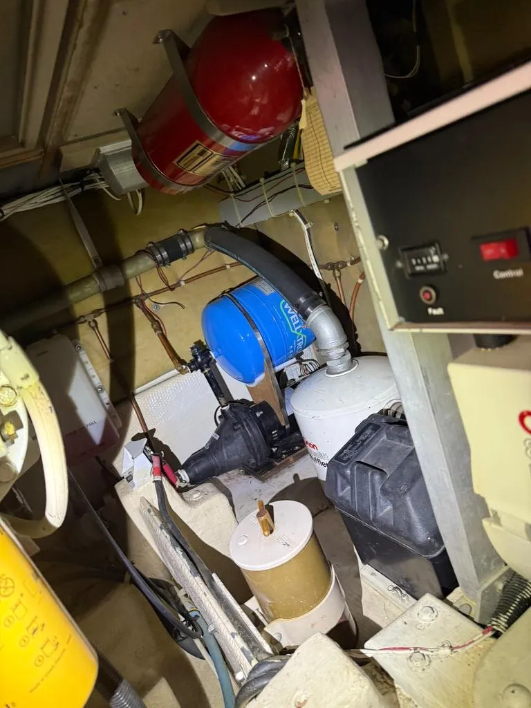 Slide: The Image of Engine room of 1989 Post 43 Sport Fisherman with equipment and fire extinguisher. - 28