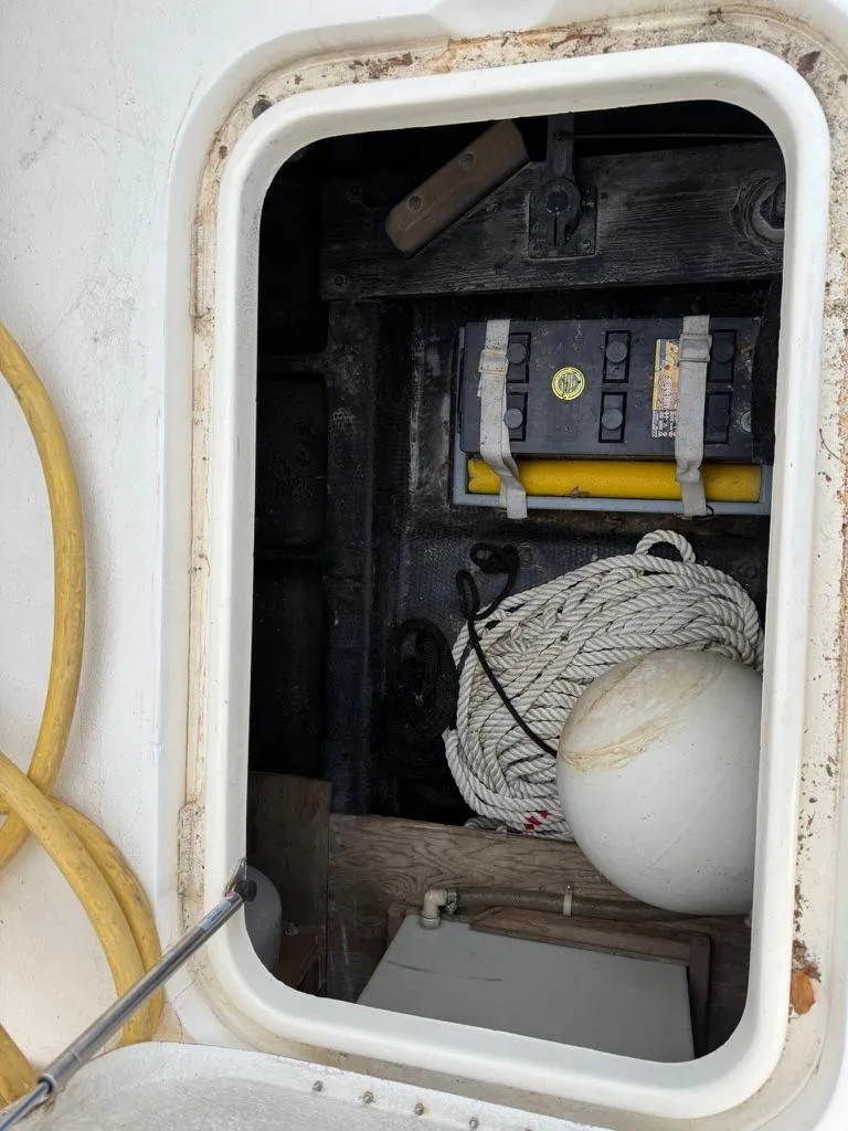 Slide: The Image of Storage compartment on 1989 Post 43 Sport Fisherman boat with rope and buoy. - 30