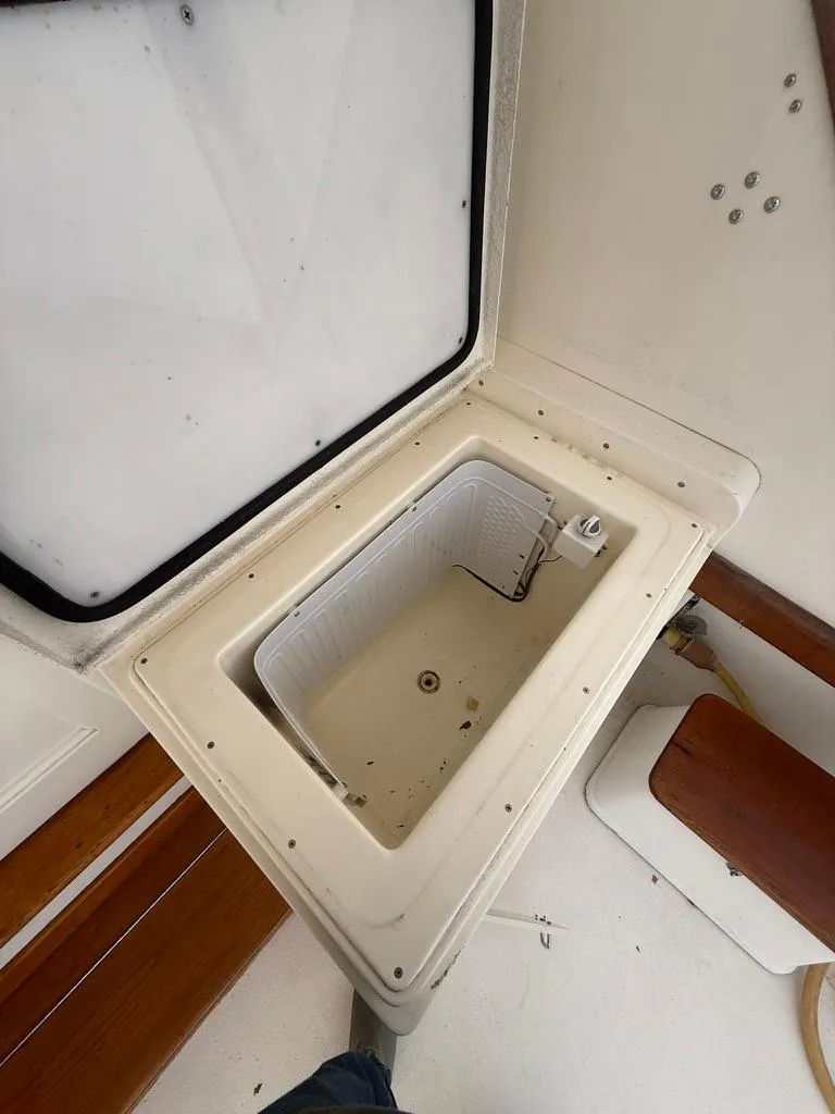 Slide: The Image of Open storage compartment on 1989 Post 43 Sport Fisherman boat. - 5