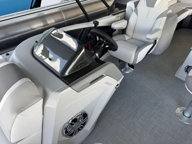 Slide: The Image of 2025 Avalon Catalina Entertainer boat interior with modern helm and comfortable seating. - 12