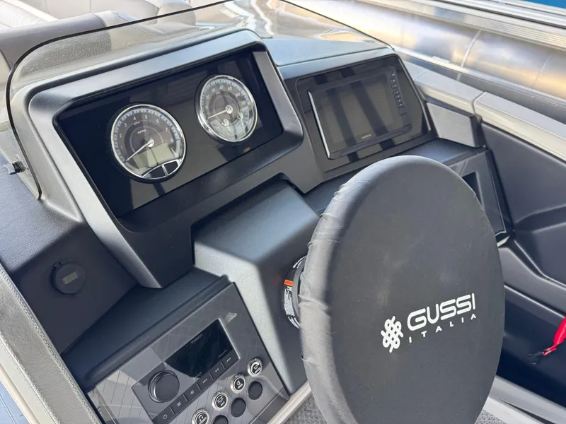 Slide: The Image of 2025 Avalon Catalina Entertainer dashboard with Gussi Italia steering wheel and modern controls. - 17