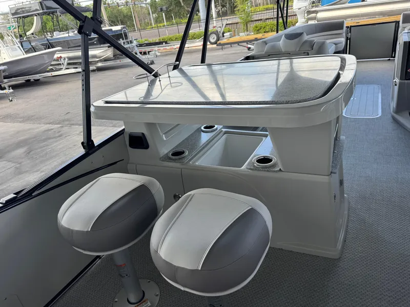 Slide: The Image of 2025 Avalon Catalina Entertainer boat interior with bar and seating area. - 20