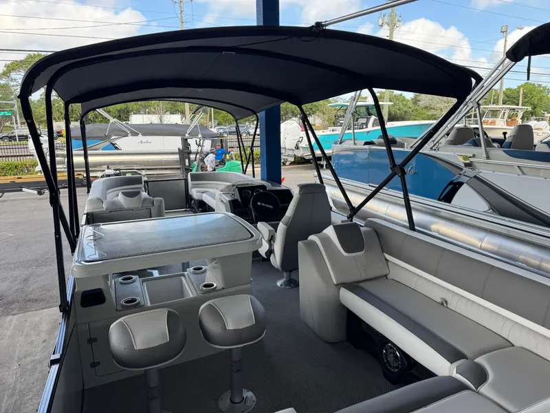 Slide: The Image of 2025 Avalon Catalina Entertainer 27' pontoon boat with spacious seating and canopy. - 22