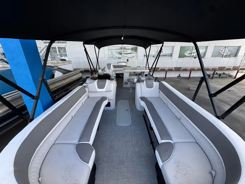 Slide: The Image of 2025 Avalon Catalina Entertainer 27' pontoon boat with spacious seating and canopy. - 7