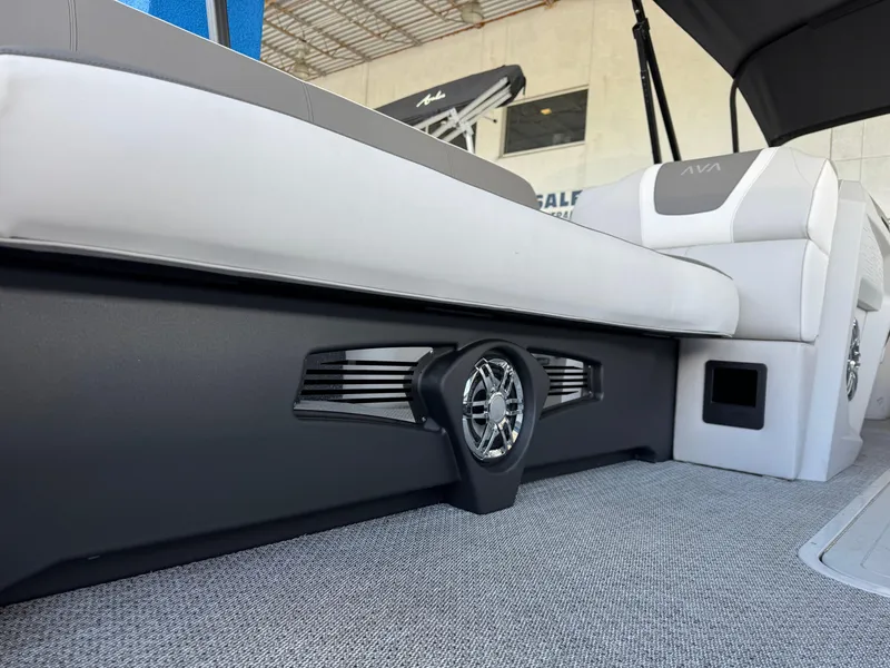 Slide: The Image of 2025 Avalon Catalina Entertainer boat interior with sleek seating and integrated speaker system. - 8