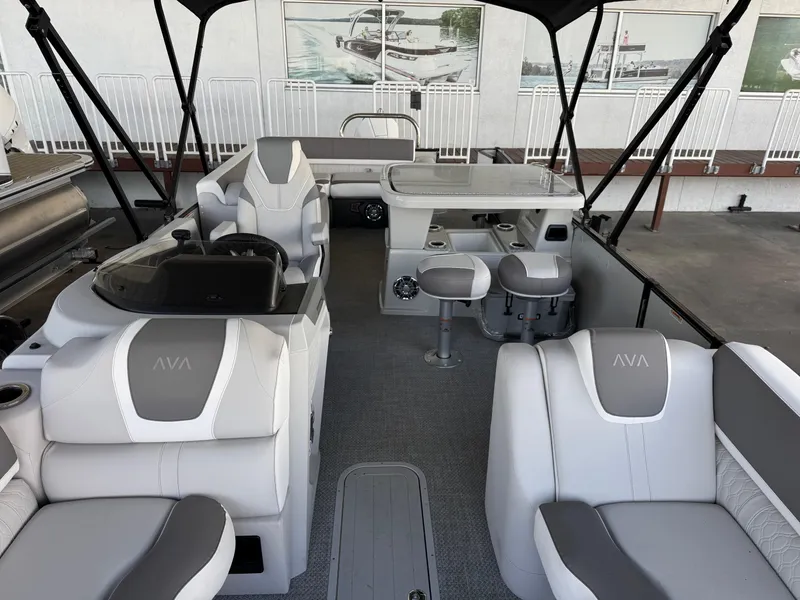 Slide: The Image of 2025 Avalon Catalina Entertainer 27' boat interior with luxurious seating and modern design. - 9