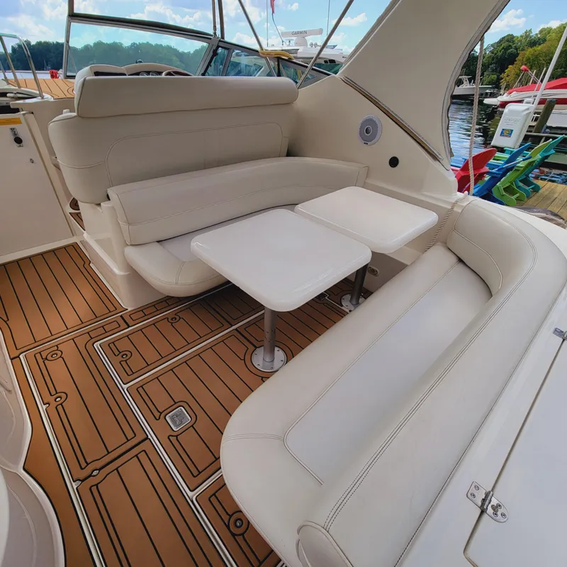 Slide: The Image of 1999 Cruisers Yachts 3075 Rogue interior with beige seating and wooden flooring. - 19