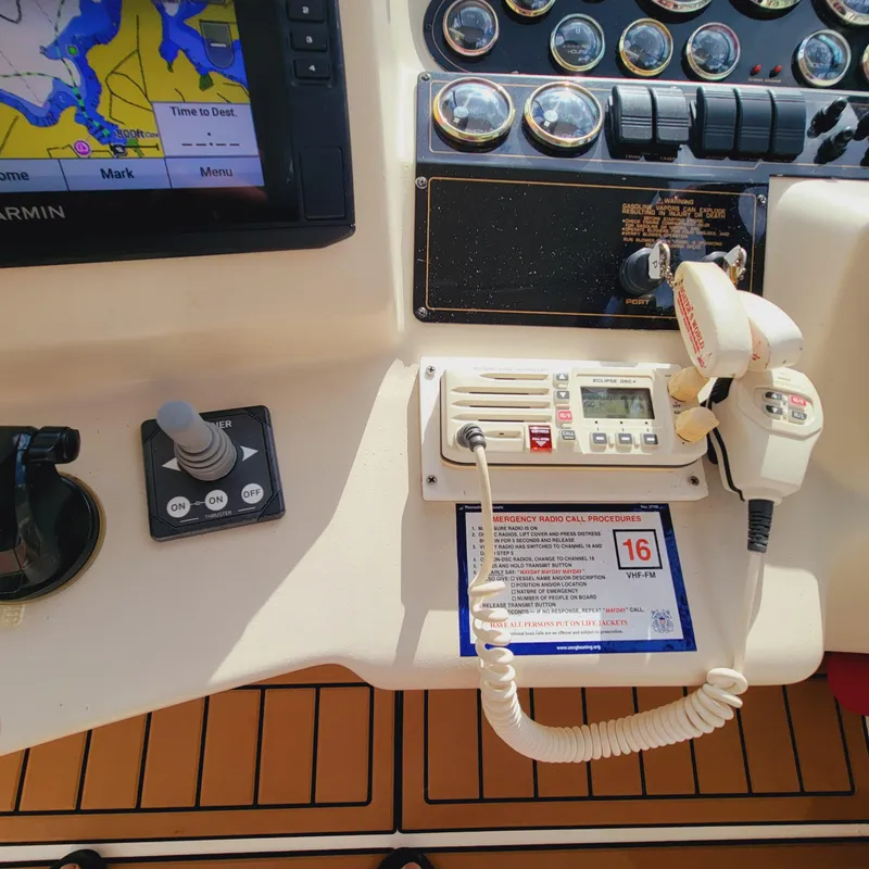 Slide: The Image of Control panel of 1999 Cruisers Yachts 3075 Rogue with navigation and communication equipment. - 25
