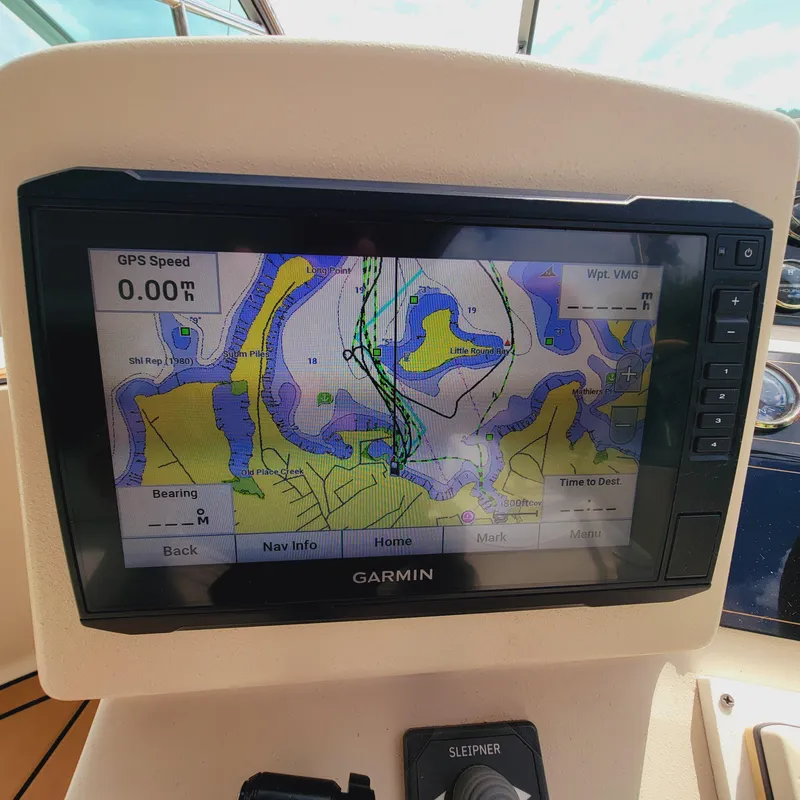 Slide: The Image of Garmin GPS display on 1999 Cruisers Yachts 3075 Rogue, showing nautical map and navigation details. - 27