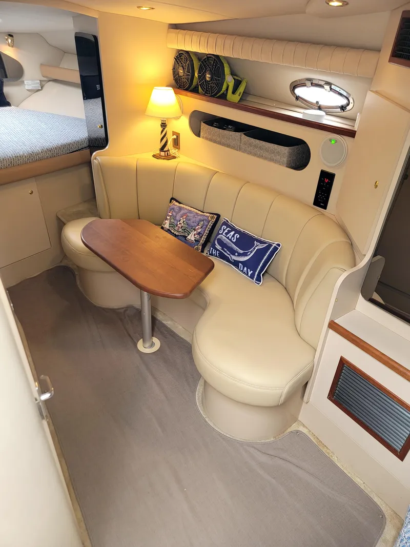 Slide: The Image of 1999 Cruisers Yachts 3075 Rogue interior with cozy seating and elegant decor. - 32
