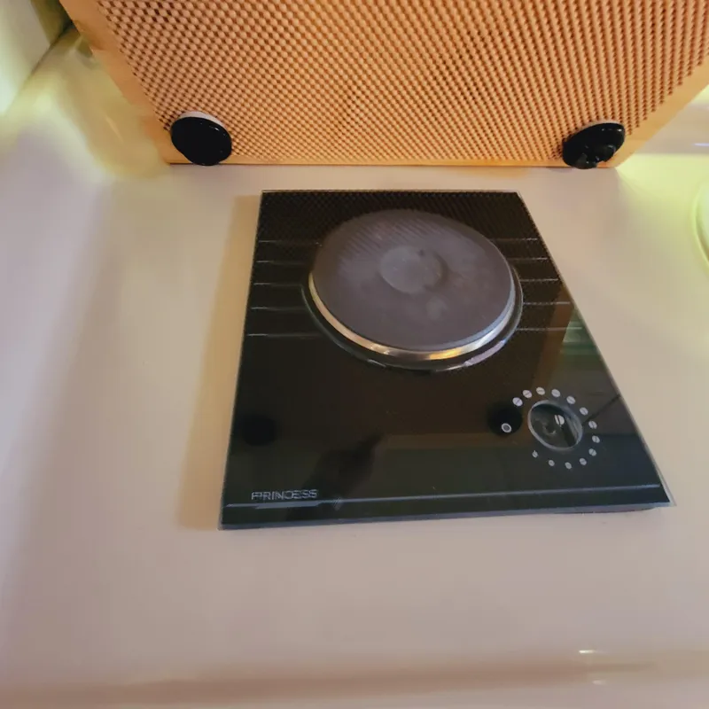 Slide: The Image of 1999 Cruisers Yachts 3075 Rogue stove with single burner and control knob. - 41