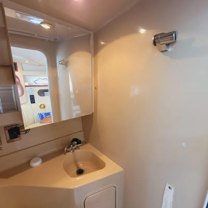 Slide: The Image of 1999 Cruisers Yachts 3075 Rogue bathroom with sink and mirror. - 47