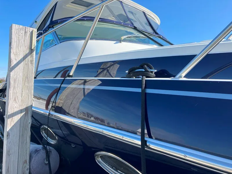 Slide: The Image of 2016 Formula 37 PC yacht docked, showcasing sleek design and polished exterior. - 10