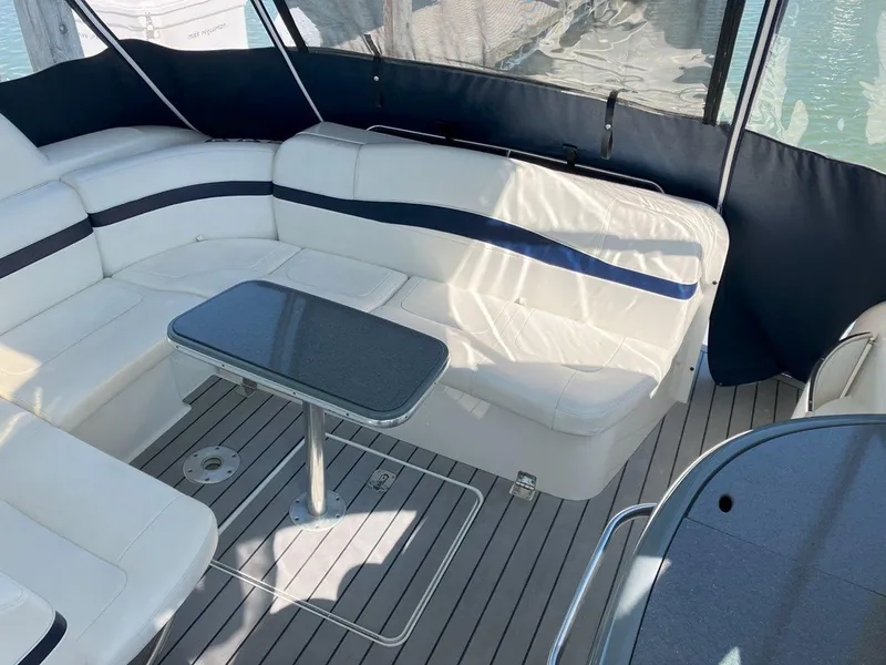 Slide: The Image of 2016 Formula 37 PC yacht interior with white seating and sleek table on deck. - 11