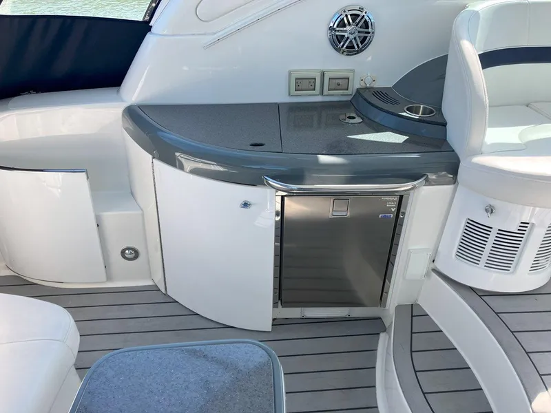 Slide: The Image of 2016 Formula 37 PC yacht interior with kitchenette and seating area. - 15