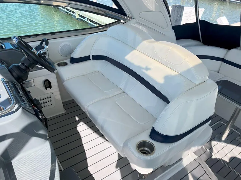 Slide: The Image of 2016 Formula 37 PC boat interior with white seating and steering wheel. - 17