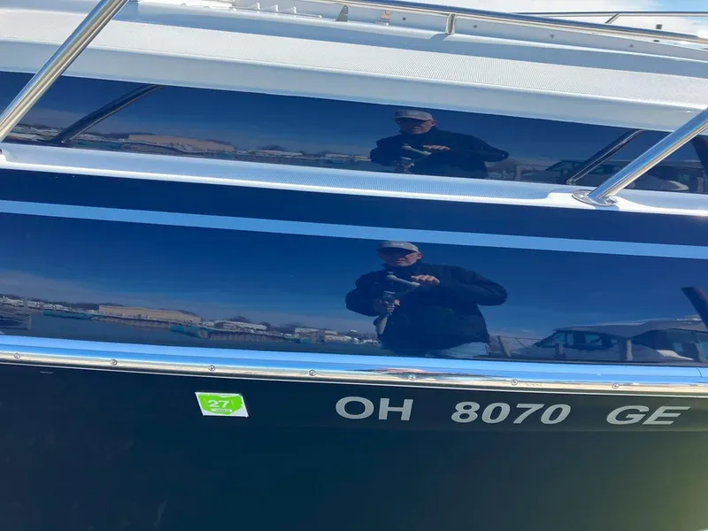 Slide: The Image of 2016 Formula 37 PC boat with reflective hull and registration number OH 8070 GE. - 2