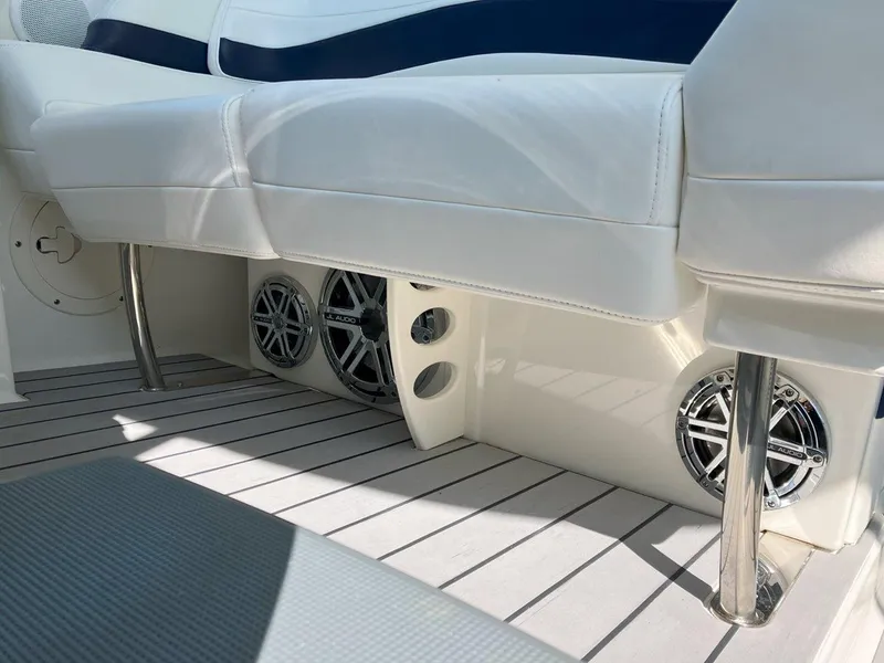 Slide: The Image of 2016 Formula 37 PC boat interior with white seating and built-in speakers. - 21