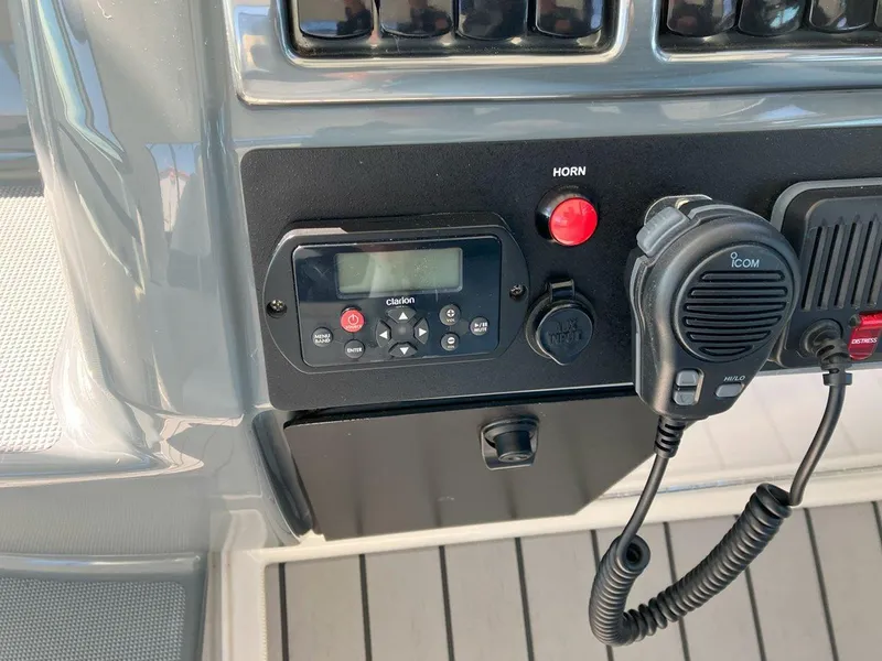 Slide: The Image of Control panel of a 2016 Formula 37 PC boat with radio and horn buttons. - 24