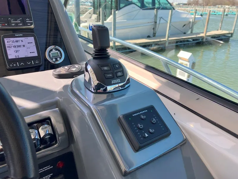 Slide: The Image of Control panel of a 2016 Formula 37 PC boat with joystick and navigation displays. - 33