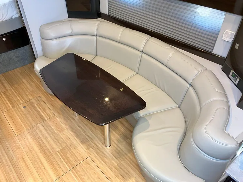 Slide: The Image of Luxurious interior of 2016 Formula 37 PC with curved leather seating and wooden table. - 35