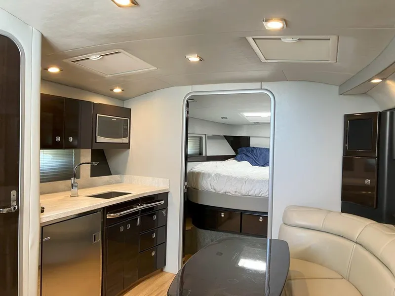 Slide: The Image of Luxurious interior of a 2016 Formula 37 PC yacht with modern kitchen and cozy bedroom. - 36