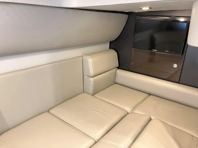 Slide: The Image of 2016 Formula 37 PC interior with beige leather seating and wall-mounted TV. - 38