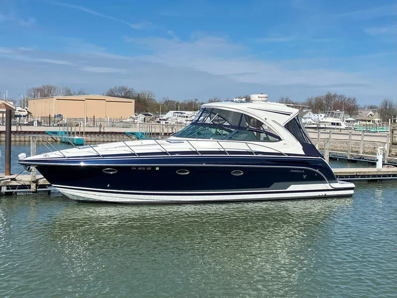 Slide: The Image of 2016 Formula 37 PC yacht docked at a marina under clear blue skies. - 4