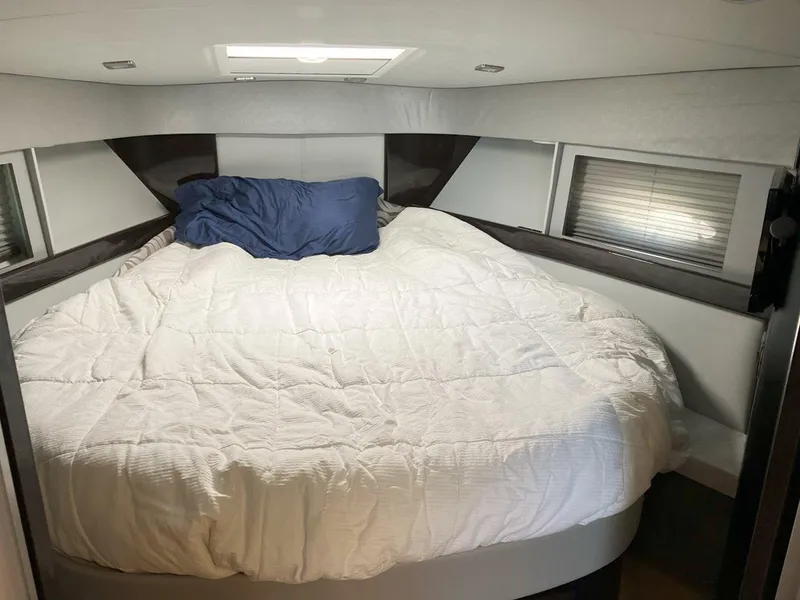 Slide: The Image of Cozy bedroom in 2016 Formula 37 PC yacht with white bedding and blue pillow. - 41