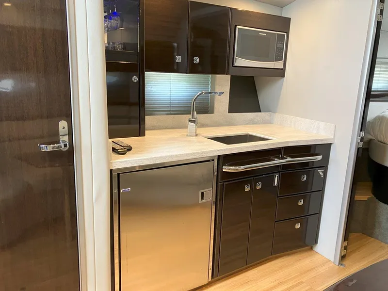 Slide: The Image of Modern kitchenette in 2016 Formula 37 PC yacht with sleek cabinets and stainless steel appliances. - 42