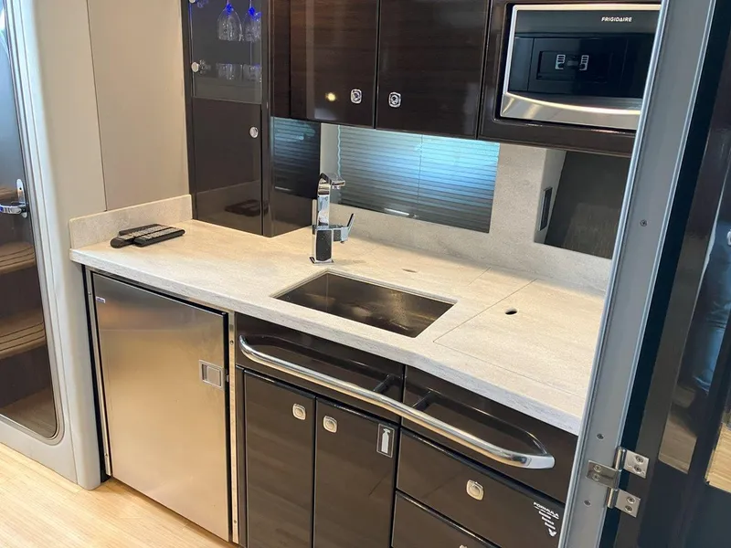 Slide: The Image of Modern kitchen in 2016 Formula 37 PC yacht with sleek cabinetry and stainless steel appliances. - 43
